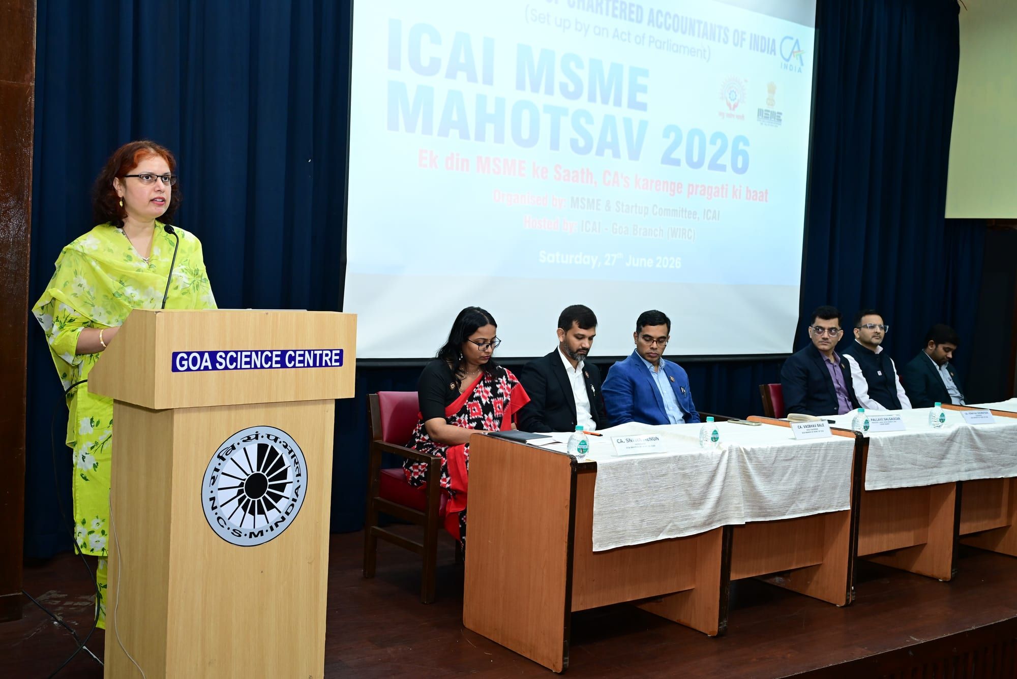 Pallavi Salgaocar speaking from the podium at the MSME Day celebrations.